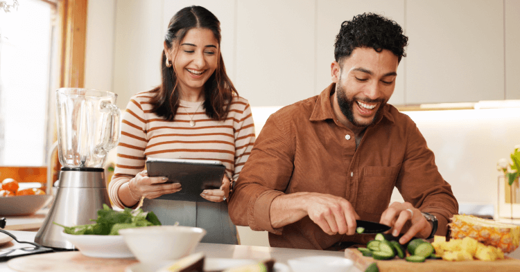 Couple making dinner together in their apartment